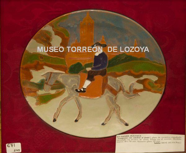 Plato con un campesino a lomos de un burro y catedral al fondo (reproducción uso personal o editorial)
